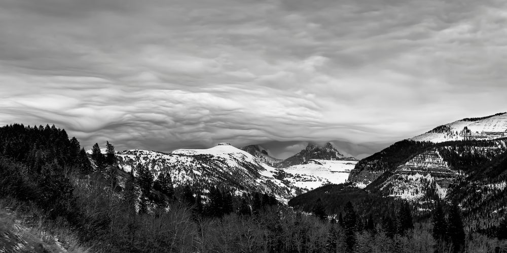 I love the Tetons, and I particularly love table Mountain, even though she is a smaller peak, usually overshadowed by her big sisters. On this winter day, I was walking my golden retriever and trying out a new camera when I saw this.  Of course I didn't have a tripod or any filters with me, so I shot this at an 80th of a second and the RAW image that resulted was terribly underexposed. I've been working trying to get a usable print out of this for a few years now and I think I'm closing in on it!