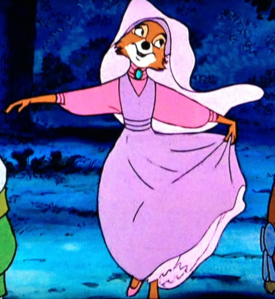 Maid Marian from Robin Hood is dancing around. She's an anthropomorphic fox in a fancy pink dress with matching veil