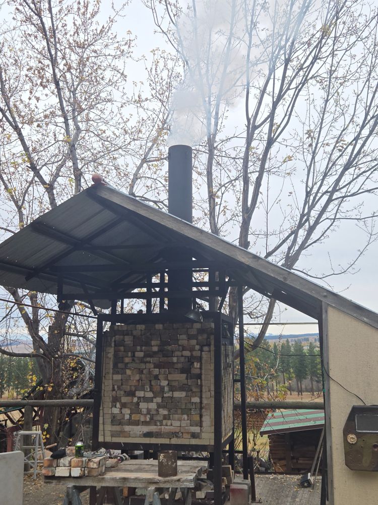 Kiln with white smoke coming out the chimney