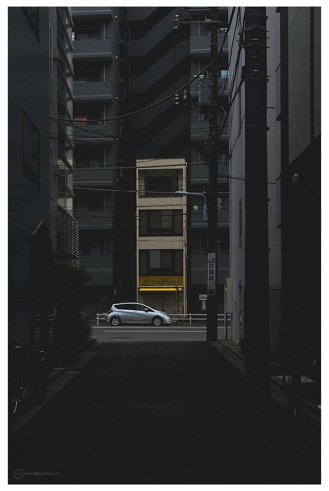 Looking up a side street off of Satakeyokocho in Tokyo. To a favourite little building, hemmed in by larger ones either side. I also love the light here. This day it was particularly nice, and the solver car added to the vibe beautifully. 