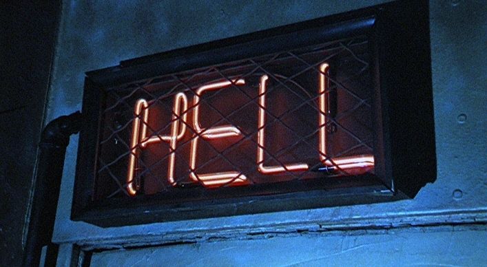 Red neon letters spell hell.