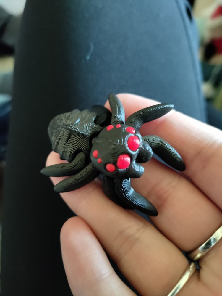 3D printed black spider with red eyes 