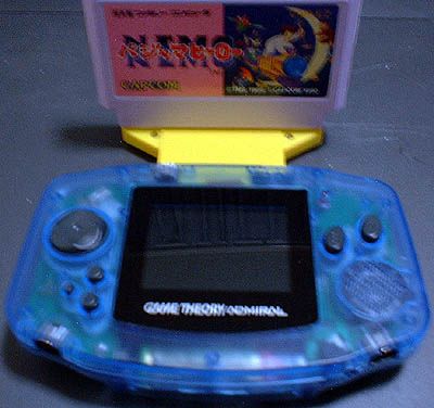 The game theory admiral - a poorly designed third party handheld for playing nes and snes games portable. Pictured with its necessary adaptor for achieving this.