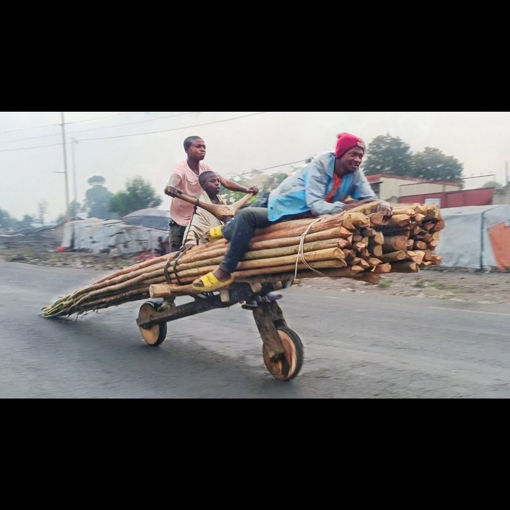 Riding Engineless Scooters on Streets of Congo