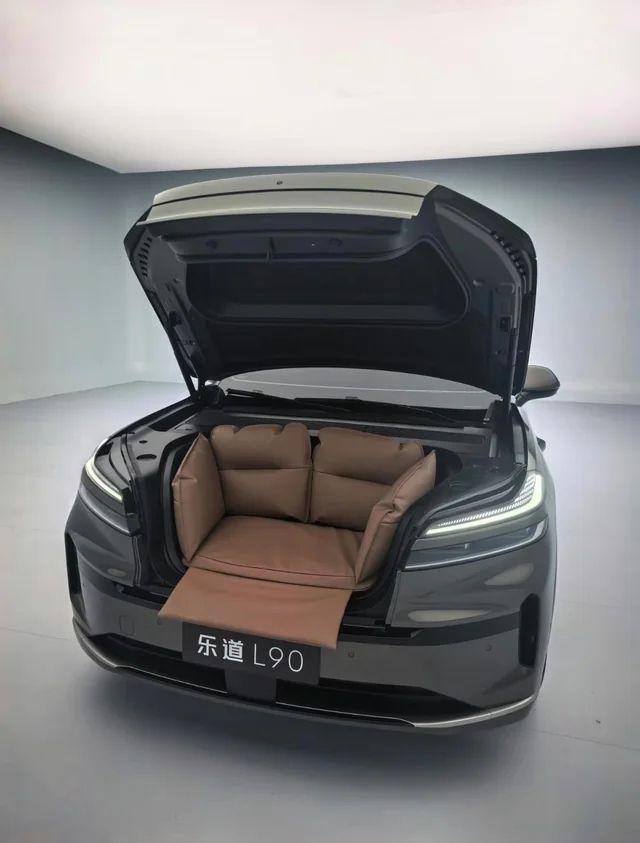 Nio ONVO L90 SUV with its frunk open, revealing a large seated space.