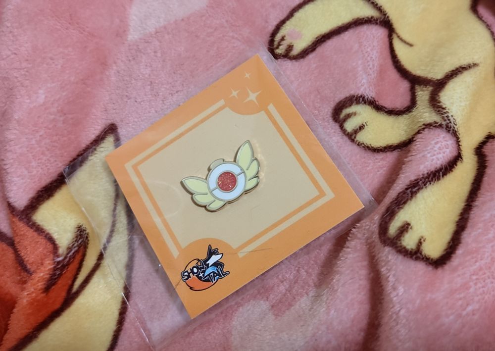 A PMD Exploration Badge pin from Show+Tail
