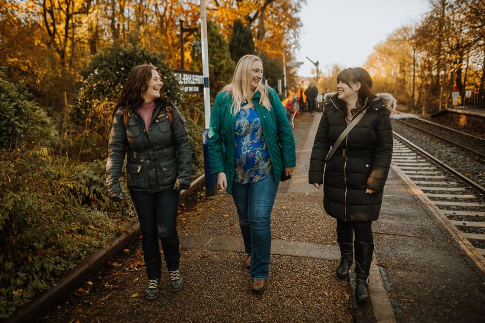 Group of people walking along platform