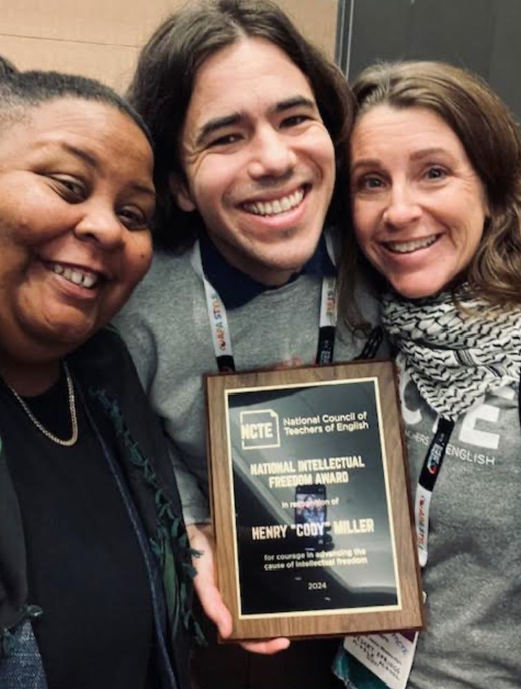 A picture of shea martin, Cody Miller, and Carrie Mattern. Cody is holding a plaque. 