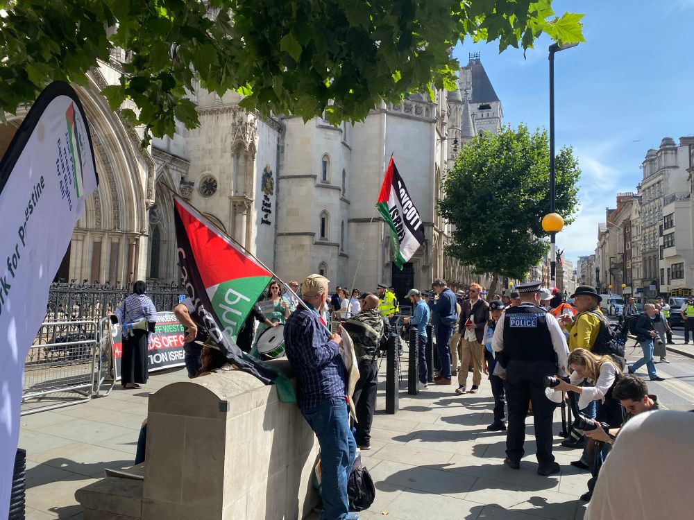 Protesters gather outside court. 