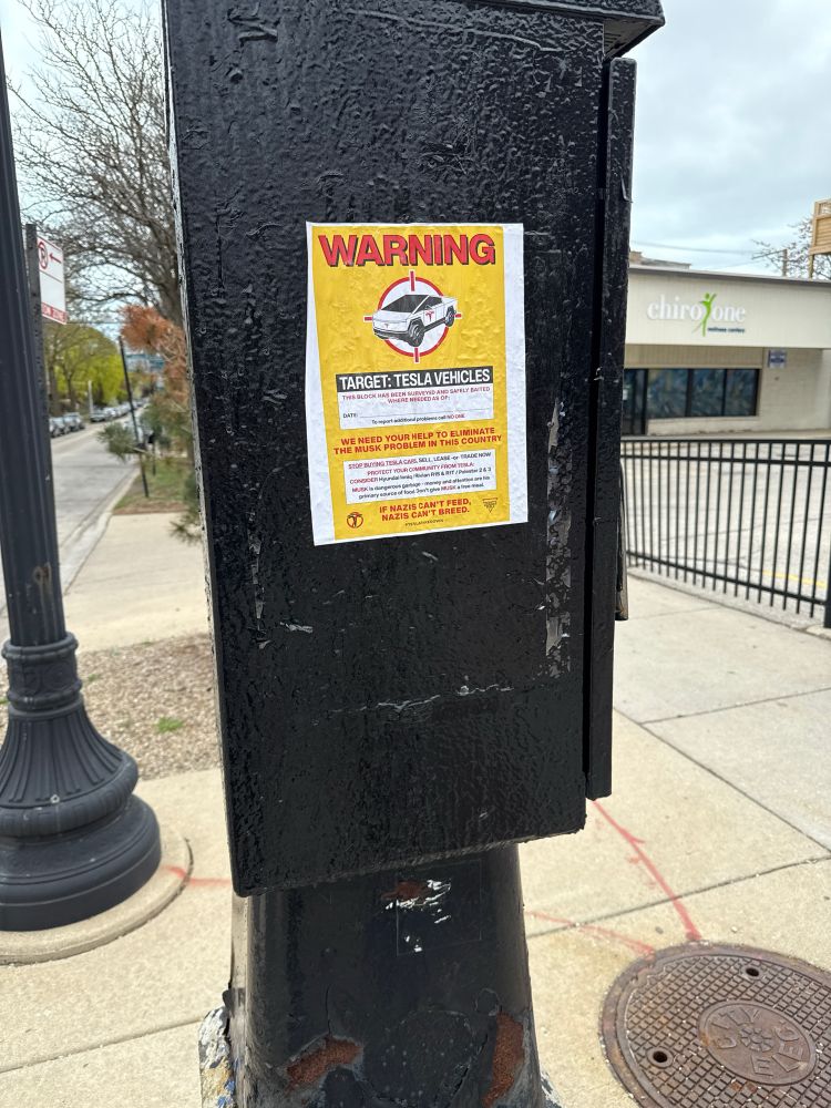 A riff on the famous Warning Rats signs in Chicago but targeting Tesla Vehicles and Nazis instead. 
