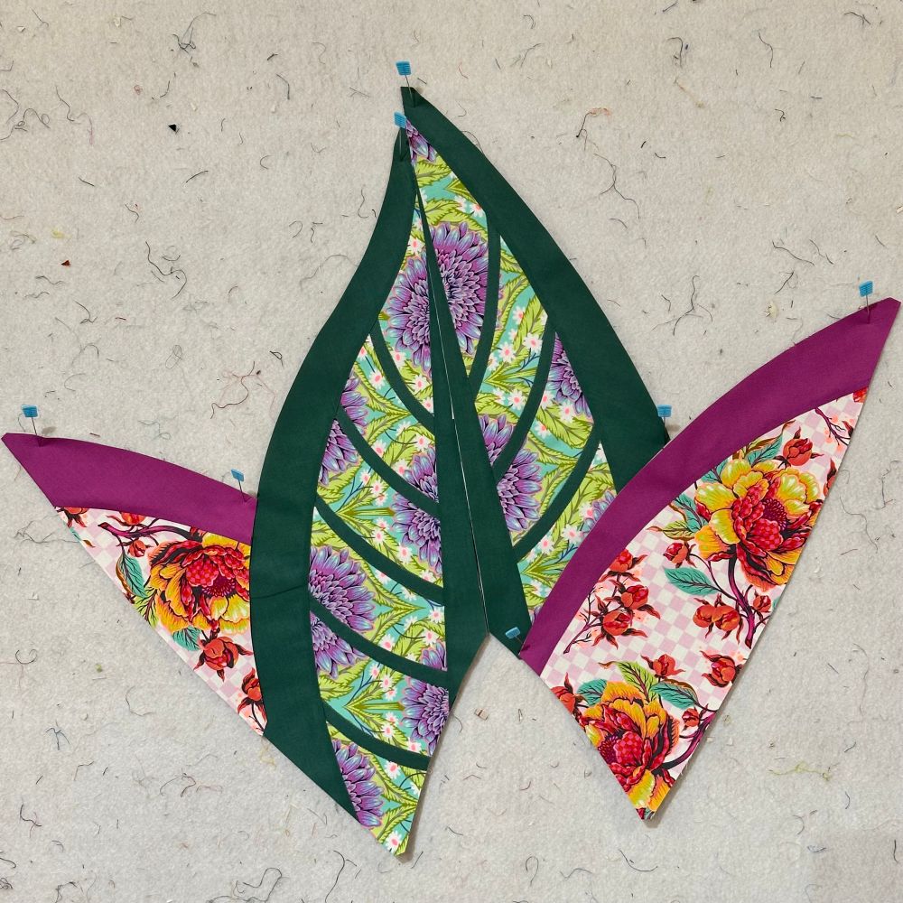 The C units for the Jungle Magnolia quilt. The narrow green lines are appliqué. 