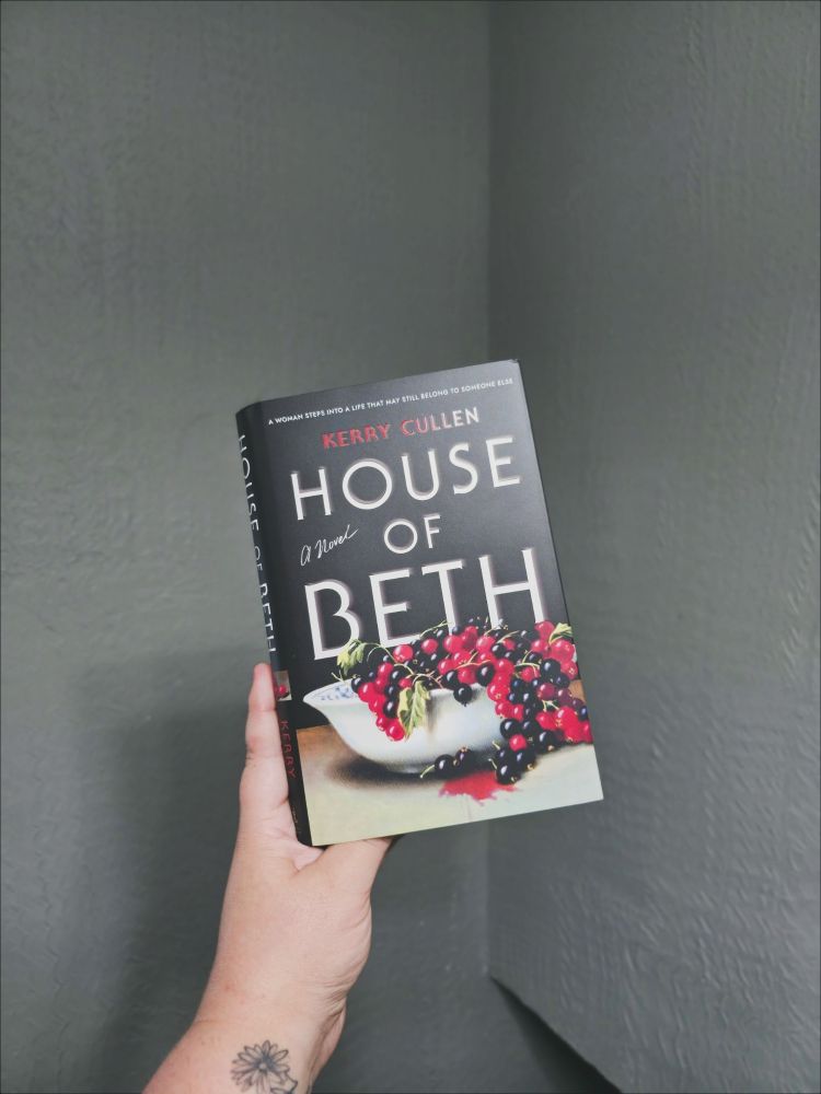 Hand holding a hardcover copy of House of Beth by Kerry Cullen