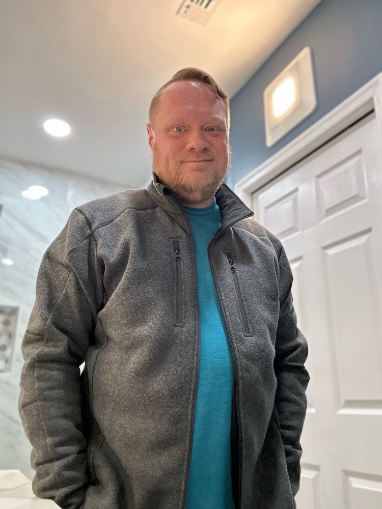 Man wearing a gray jacket