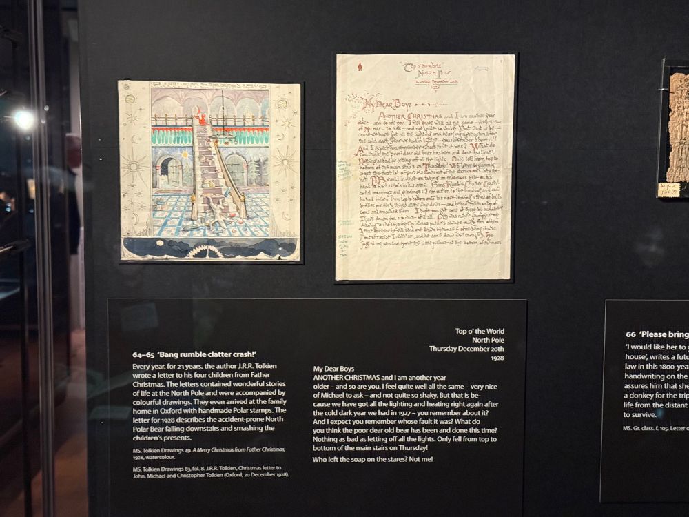An image from the Treasured exhibition showing an illustrated page by JRR Tolkien (Polar Bear felling down the stairs) and the Father Christmas letter that goes with it. 