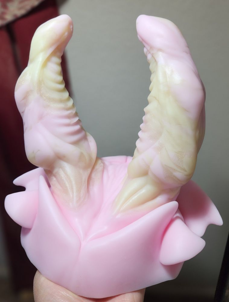 Bruce model from bad dragon in pink, yellow and gold