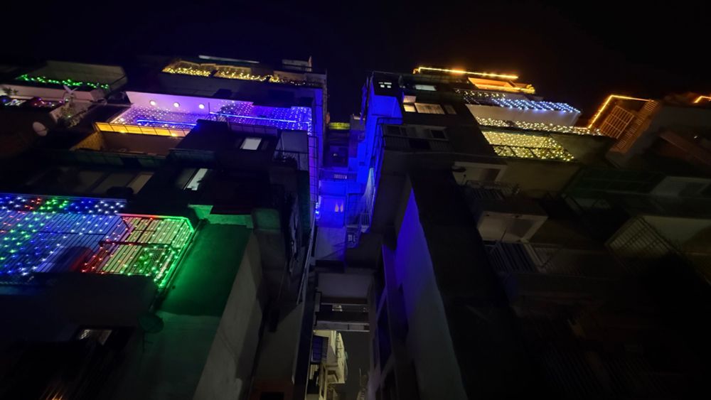 Lights on the buildings for Diwali in a south Delhi colony 