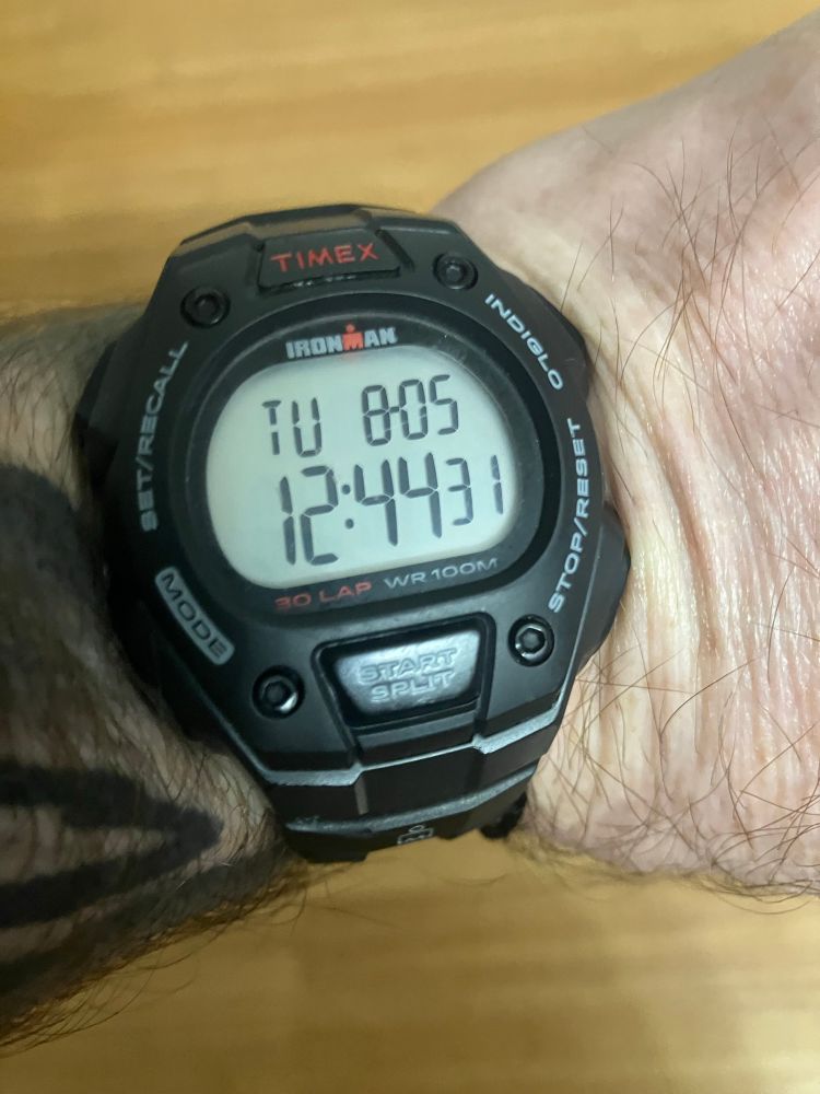 About to #LiveStream the #DailyRoutine of #Meditation #Yoga and #MartialArts! We will start around 1pm. Join me on YouTube @AlishareQerechok ! Picture of a cheap watch showing the time 12:45 on 8/5/25. We will be listening to the audiobook “A People’s History of the U.S.”.