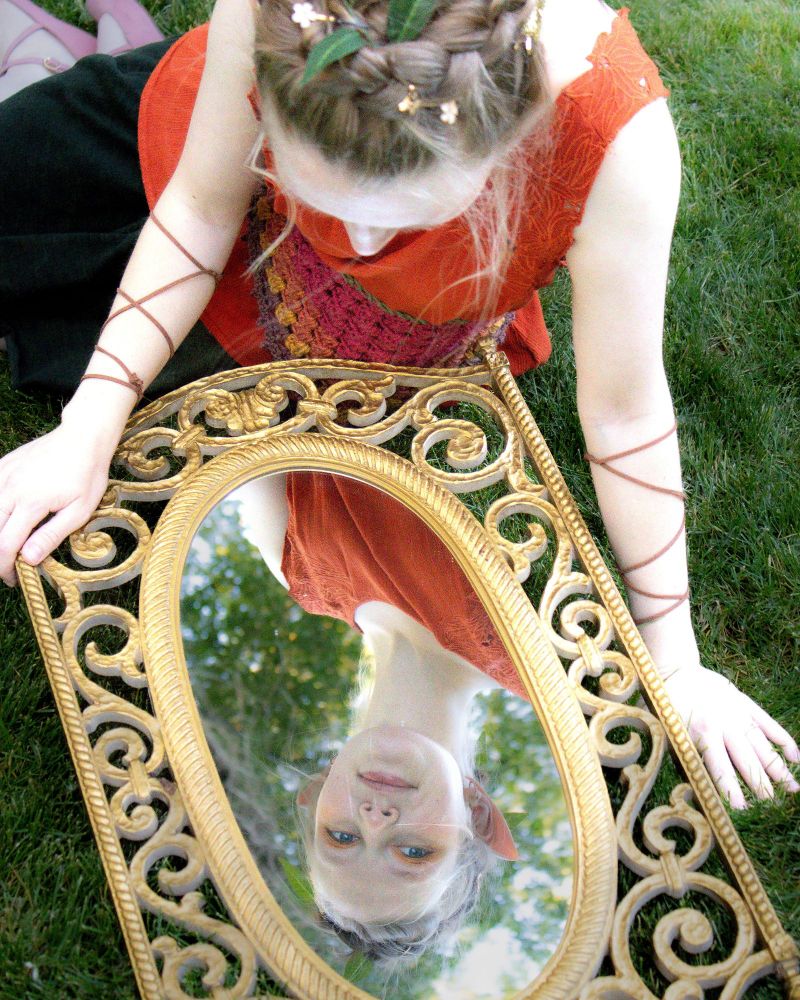Me dressed as a fairy looking in a mirror