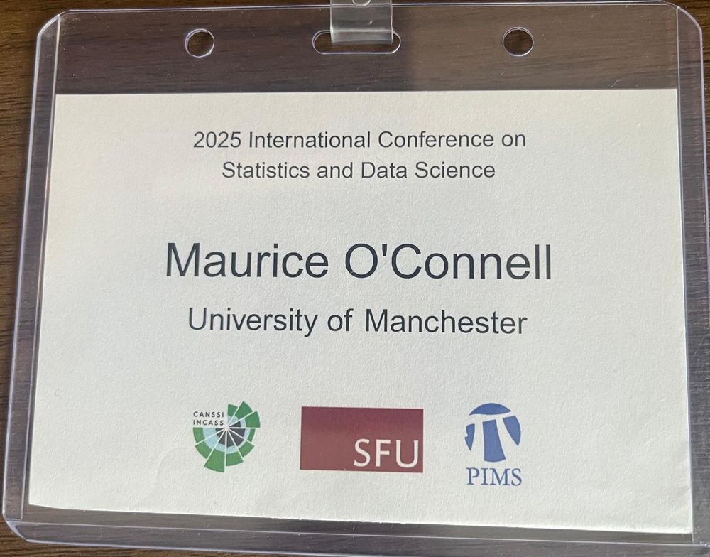 Close-up of a conference badge for the “2025 International Conference on Statistics and Data Science.” The badge reads: "Maurice O’Connell, University of Manchester" and includes logos for CANSSI, SFU (Simon Fraser University), and PIMS.