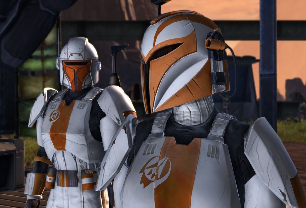 SWTOR characters; two humanoids in Havok Squad orange and white trooper armor, but also wearing color matched mandalorian tracker and commander helmets.
