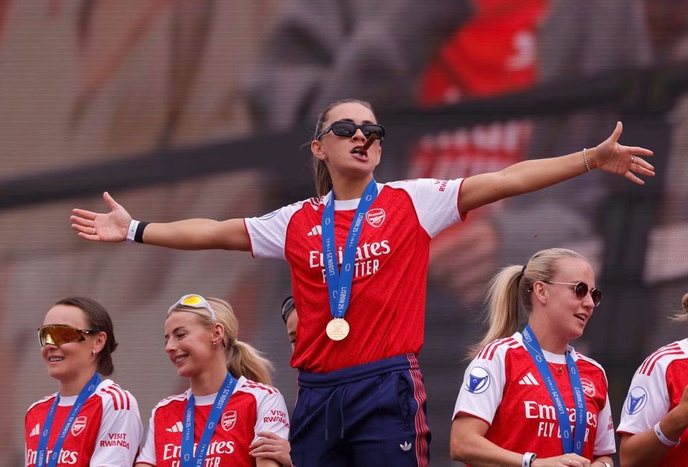 Katie McCabe leads the celebrations in North London for Arsenal Women's Champions League winners parade.