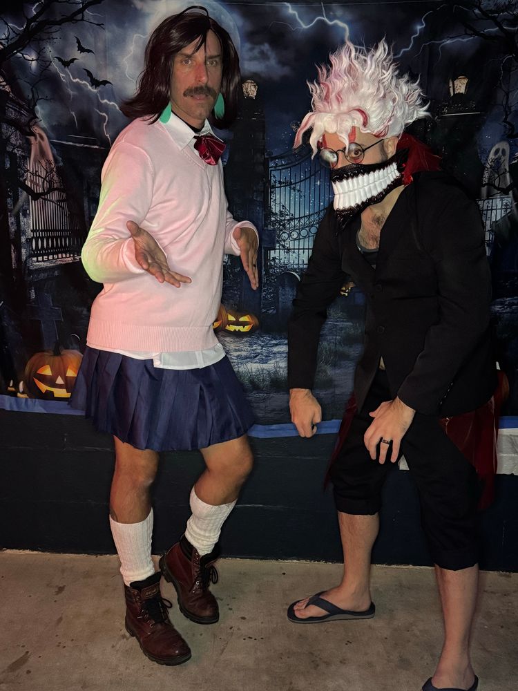 Two men dressed as Momo and Okarun from the anime DanDaDan