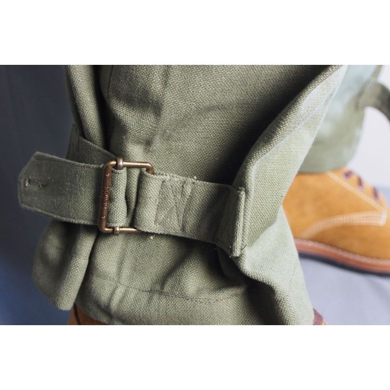 Closeup of the pants' ankle, which narrows with D-rings