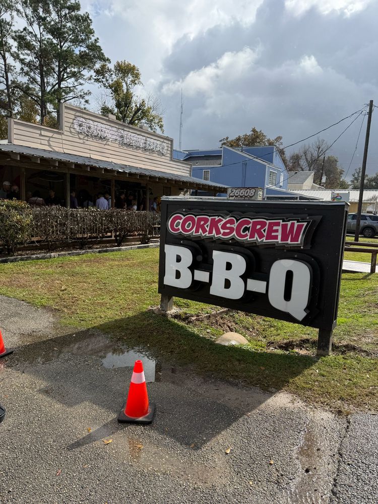Sign outside business reads Corkscrew BBQ. A restaurant in Olde Town Spring that has been given 1 Michelin star 