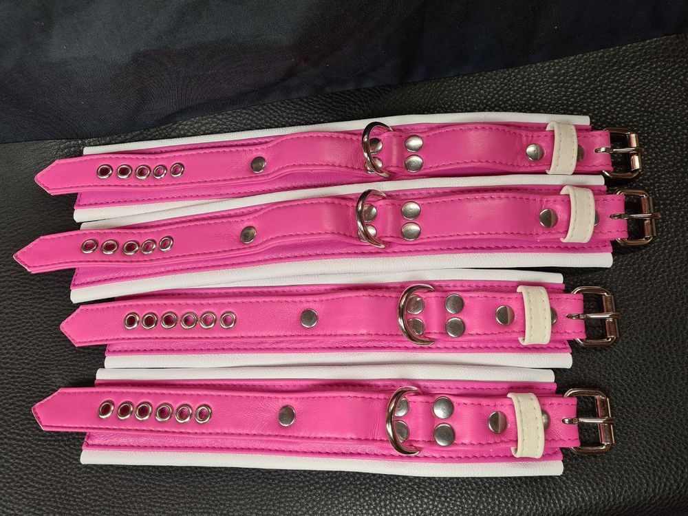 Hot pink and white cuff set, ankle and wrist cuffs. Top laid out view