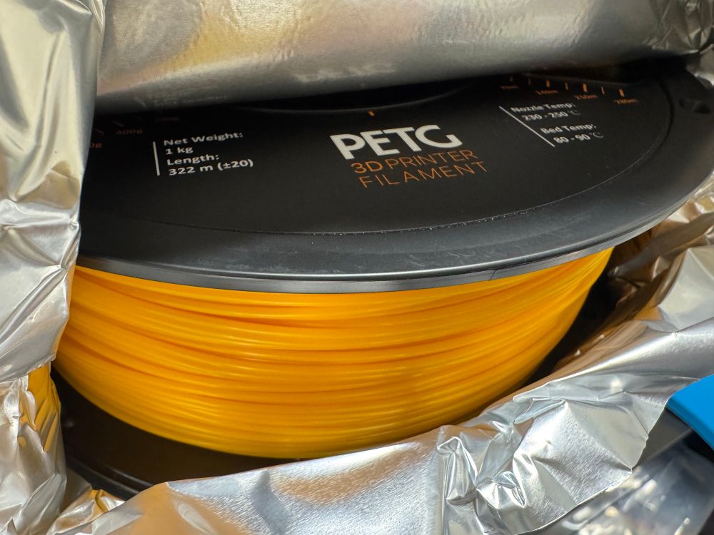 I might be partially colorblind but even I can see that this isn’t black filament. Orangish?