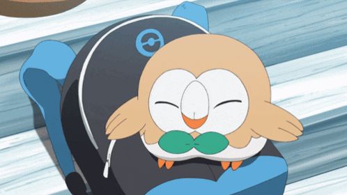 a cartoon owl with a green bow tie is laying on a blue item