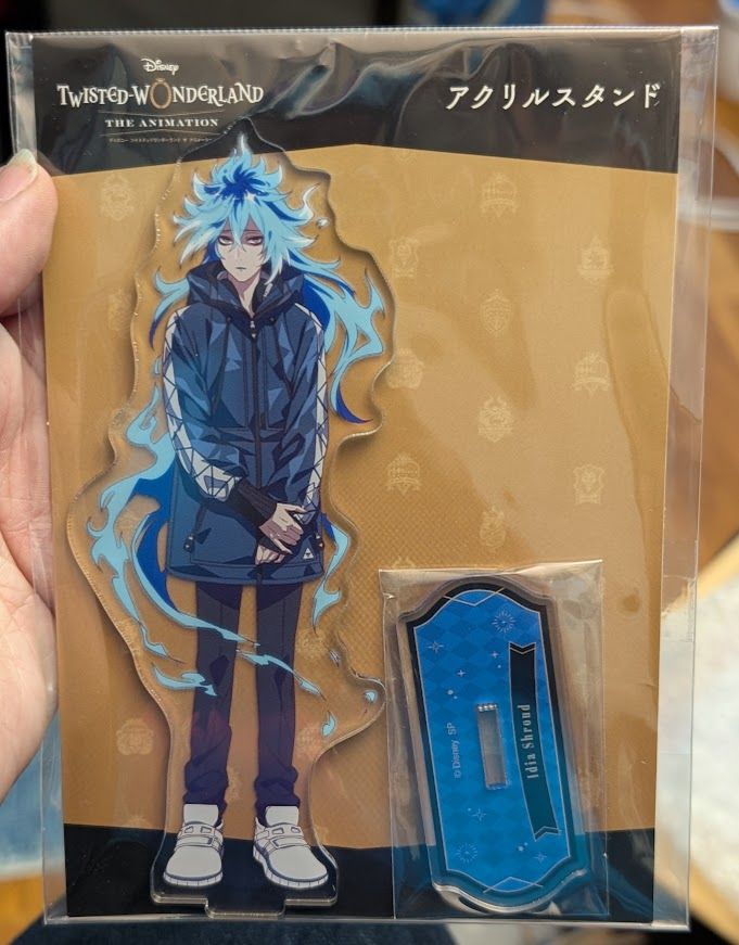 A photograph of an acrylic stand of the Disney Twisted Wonderland the animation version of the character Idia Shroud.