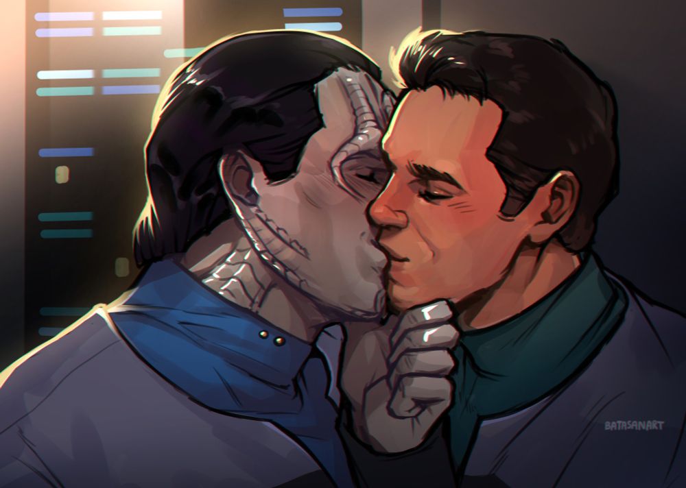 It's a close-up shot of Bashir and Garak, characters from Star Trek: Deep Space 9, kissing in the medbay.