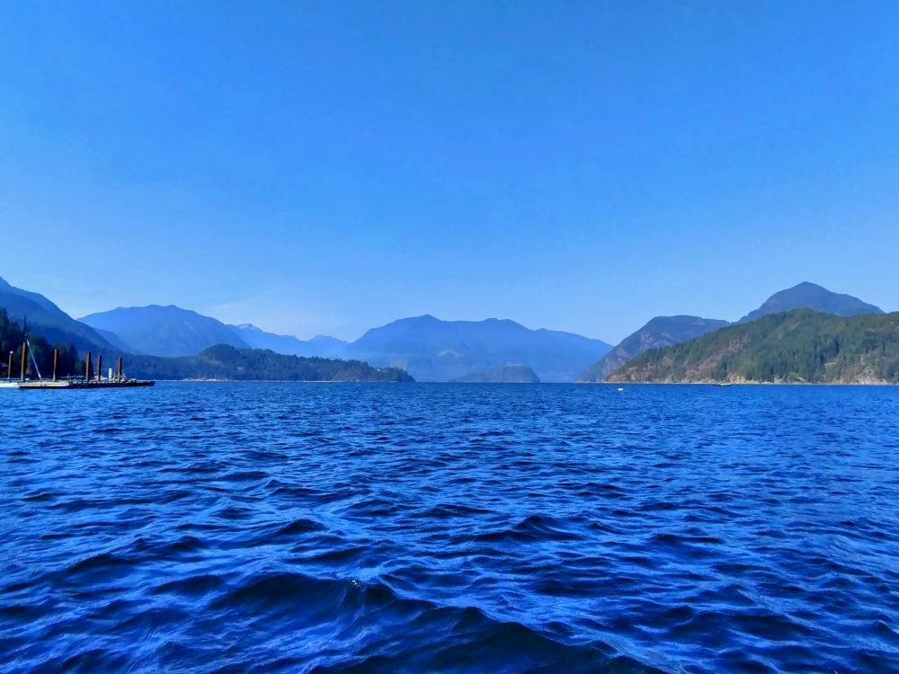 A view of the mountains from a canoe off the Sunshine coast. The Pacific Ocean radiates beautiful blues.
