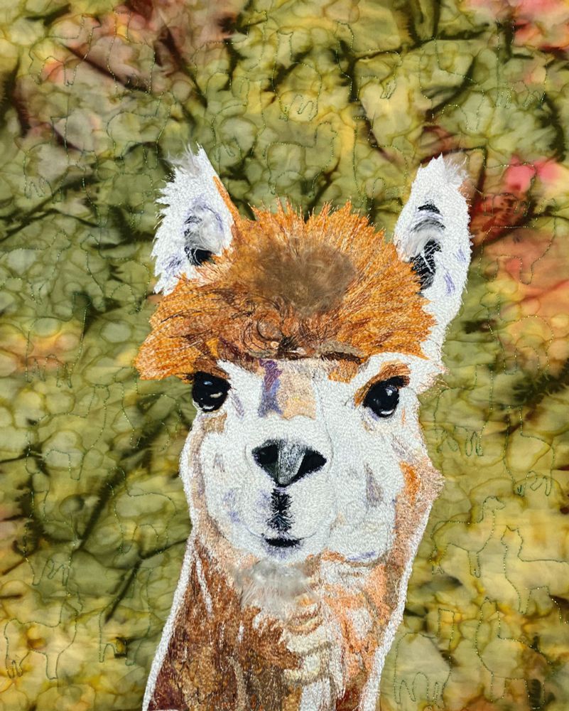 Quilted and thread painted alpaca.