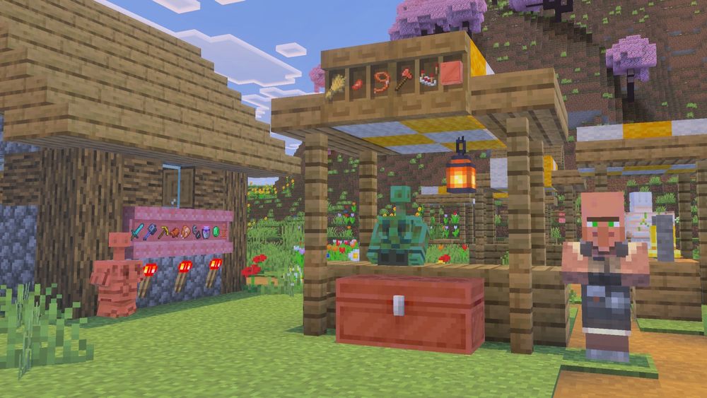 Copper statues in a village setting. Shelves with items can be seen also.