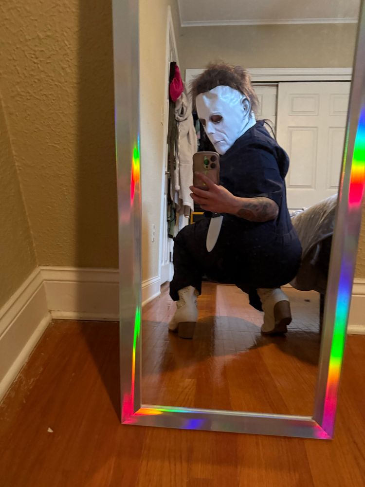 Sexy Michael meyers in cowboy boots squatting down serving over the shoulder 