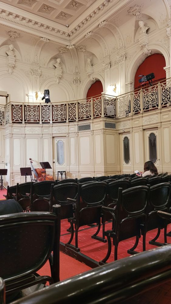 Inside a concert hall before a performance of classical music