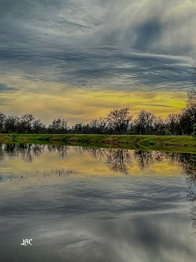 sunset over a Lema Ranch pond
