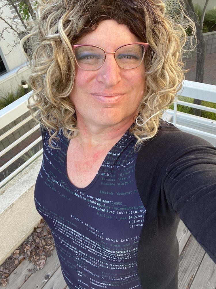 Me wearing my dress with a small portion of the source code from DOOM printed on it