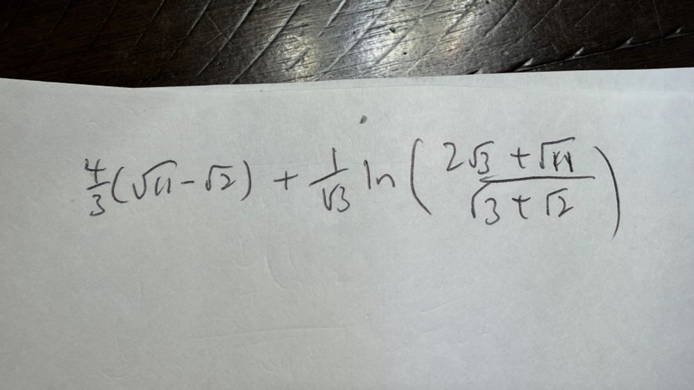 Handwritten expression representing the number:

4(√11 - √2)/3 + ln((2√3 + √11)/(√3 + √2))/√3