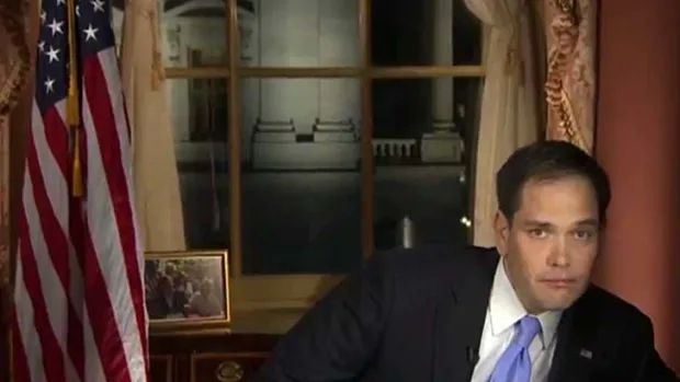 Rubio reaching for a bottle of water during a national TV address. 