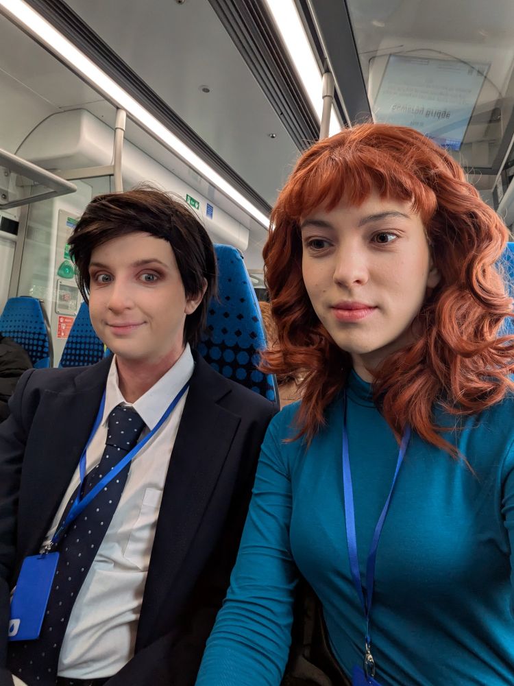 cosplayers dressed as Mark S and Helly R from Severance