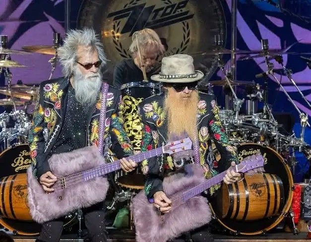 ZZ Top playing furry purple guitars