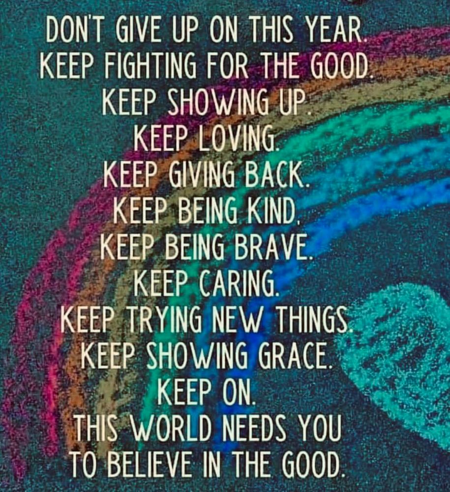 An image of a rainbow over a heart drawn in chalk with a message about believing in the good, being kind, and not giving up.