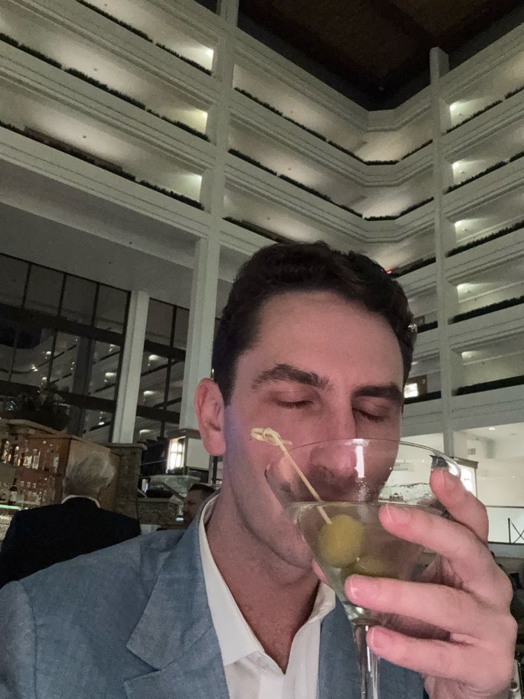 Gay man with dirty martini, once again looking for attention