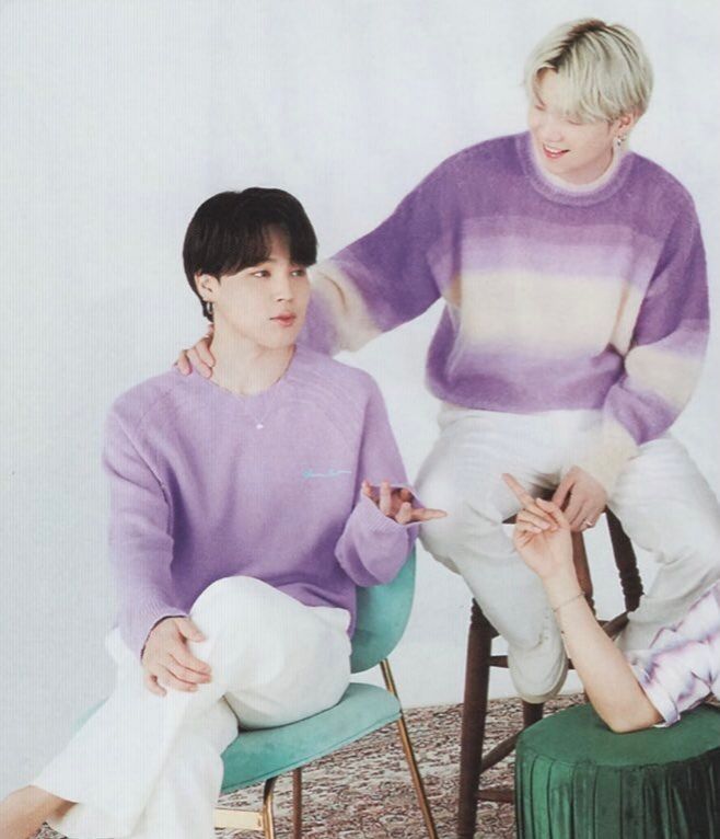 The same as the other picture except Yoongi has his arm and hand around Jimin's neck and is smiling at him.