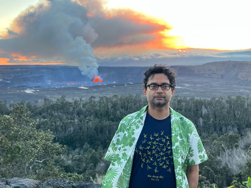 Me in a Hawaiian shirt with Kilauea spewing molten lava in the background