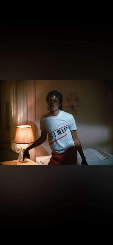 Beat It music video with photo of Santo Niño above bed 
