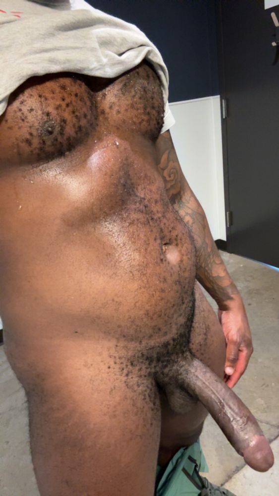 Twerk, with his shorts down, and shirt lifted up revealing a sweaty body and hard cock 